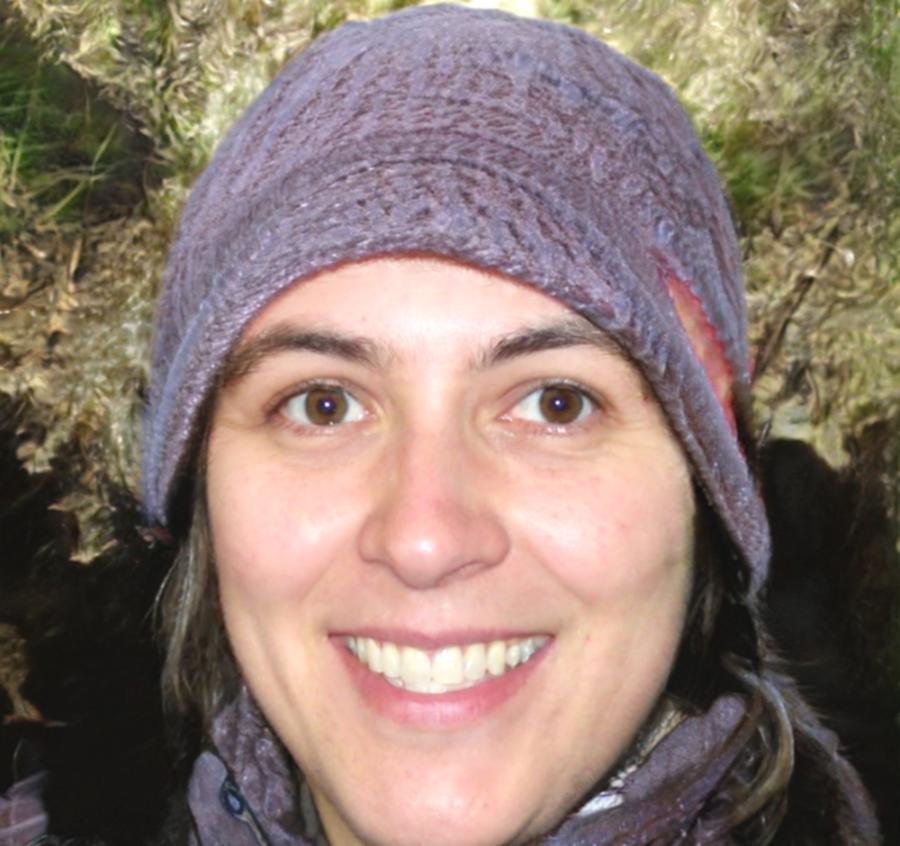 Lead instructor reviewing student financial model during one-on-one feedback session